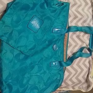 Coach hand bag with matching cosmetic bag